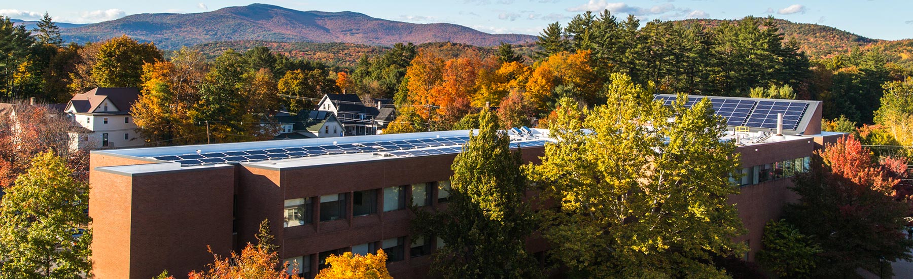 School building with solar panels on roof.