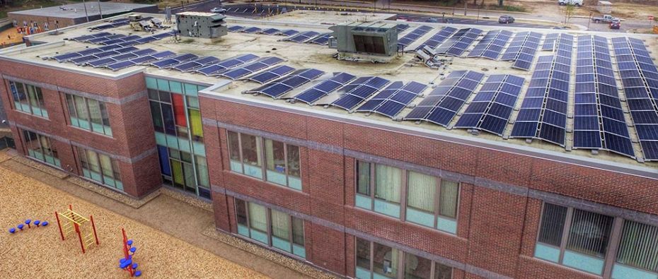 Elementary school with solar panels on the roof. Elementary school with solar panels on the roof.